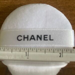 Chanel Black Cosmetic Bag plus 8 chanel puffs for make-up applications.